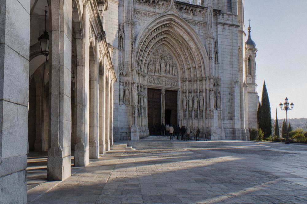 The cathedral entrance portal with the palace arcade alongside in morning light