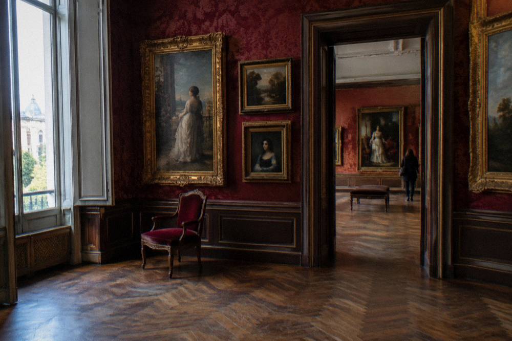 A gallery room with classical paintings in a Madrid museum