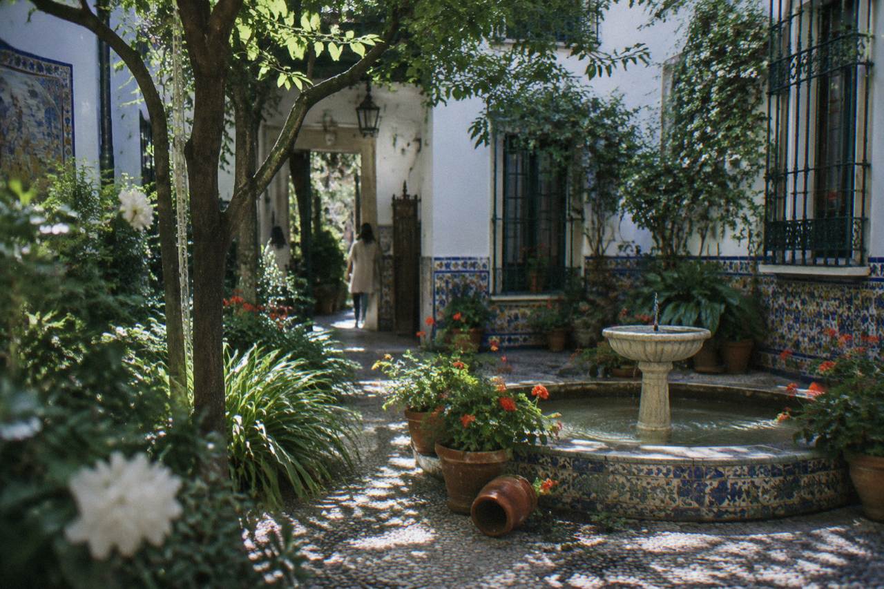 The garden courtyard facade of the Sorolla house-museum in Madrid with tiled walls and plants