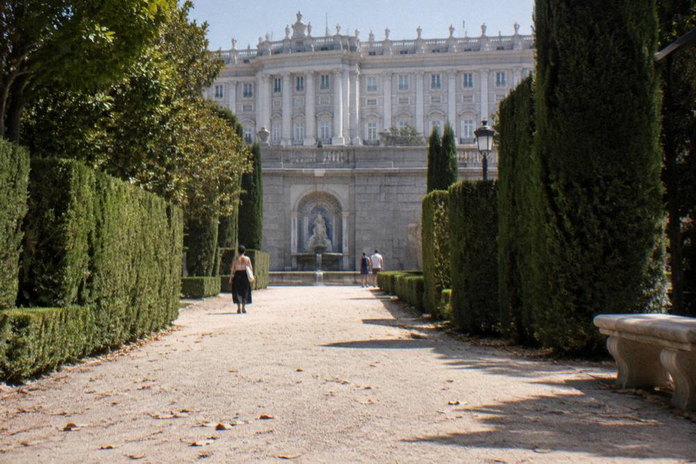 Formal hedges and fountains of the Sabatini Gardens with the Royal Palace rising behind them