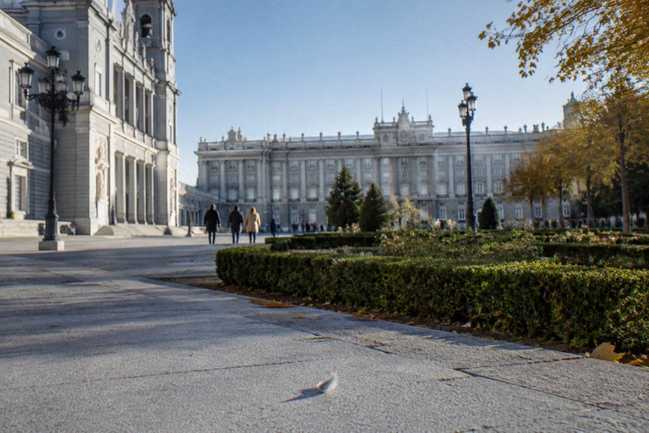 The Royal Palace of Madrid facade seen from the Almudena Cathedral esplanade with gardens in the foreground