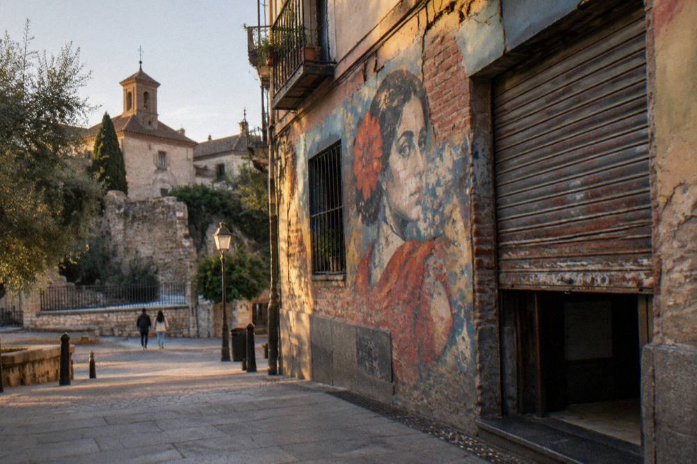 Painted wall mural on a Malasaña building facade