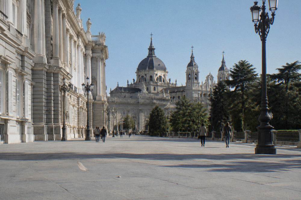 Royal Palace of Madrid seen from the esplanade with Almudena Cathedral behind