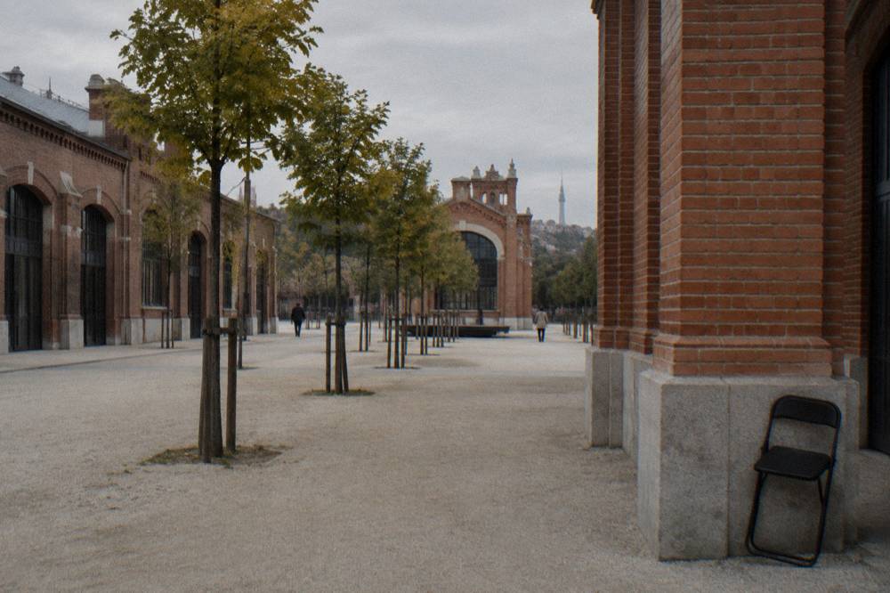 Red brick pavilions of a converted industrial building with open courtyards and people-free walkways