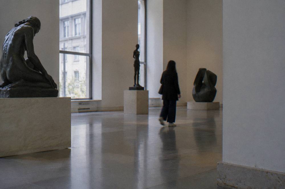 A quiet upper gallery of the Reina Sofía with modern sculptures on display