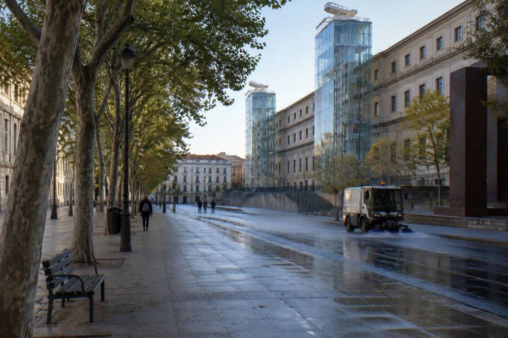 The Paseo del Arte boulevard leading toward the museum at golden hour