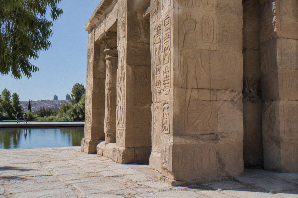 Ancient Egyptian temple gateway with carved stone columns in a Madrid park